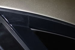 Driverssidecrackedrearwindowtrim.jpg