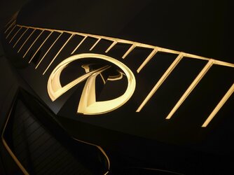 INFINITI Vision Qe concept emblem gold.jpg
